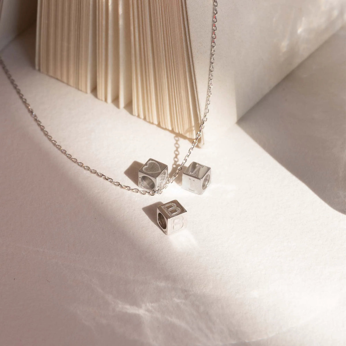 Saint Germain Felie 14 karat white gold cube initial charm with letter